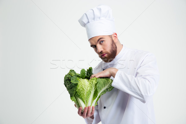 Male chef cook holding cabbage Stock photo © deandrobot