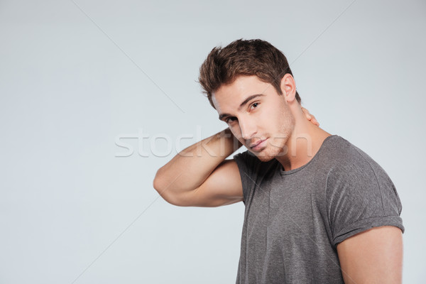 Portrait of a handsome young man looking at camera Stock photo © deandrobot