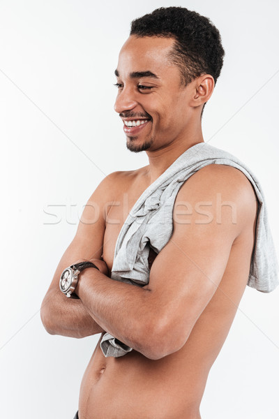Happy african man posing over white background Stock photo © deandrobot