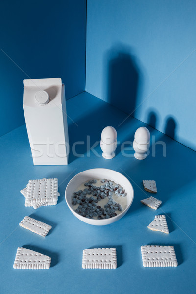 Top view of milk pack, eggs, cookies and chocolate balls Stock photo © deandrobot