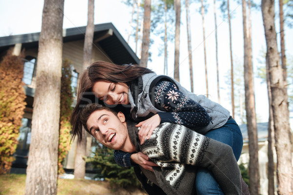 Couple jouer maison femme équitation [[stock_photo]] © deandrobot