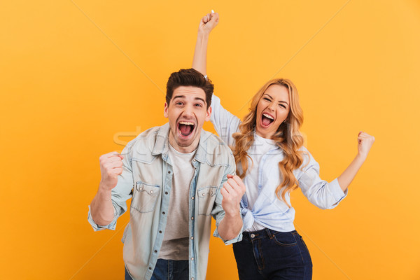 Portrait of cheerful people man and woman in basic clothing smil Stock photo © deandrobot