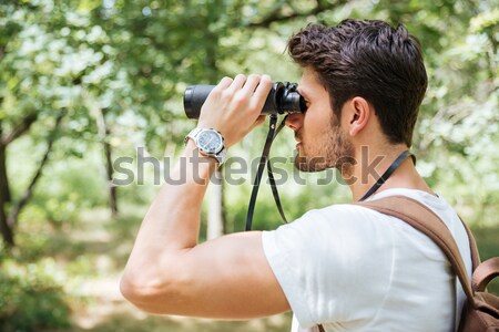 Portrait of beautiful sporty woman 20s in sportswear using smart Stock photo © deandrobot