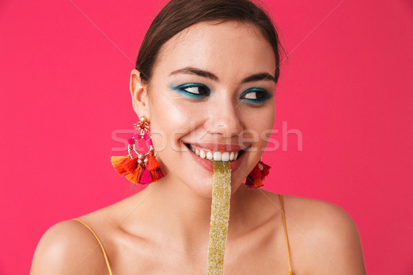 Image closeup of joyous charming woman 20s wearing fashion earri Stock photo © deandrobot