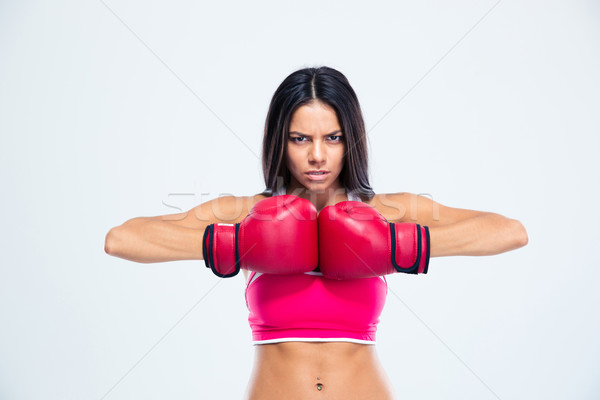 Sporty woman in boxing gloves Stock photo © deandrobot