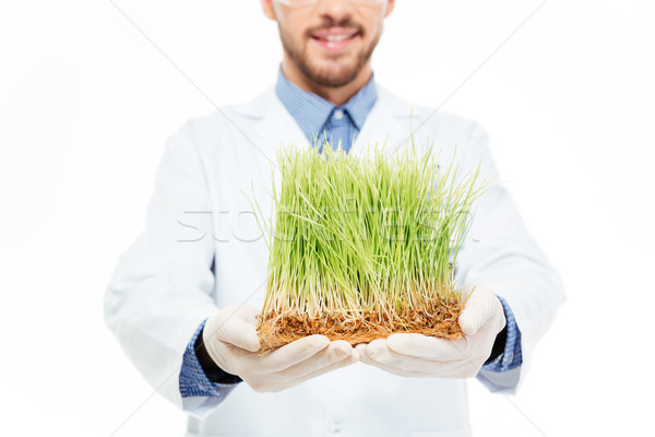 Male engineer showing a modified plants Stock photo © deandrobot