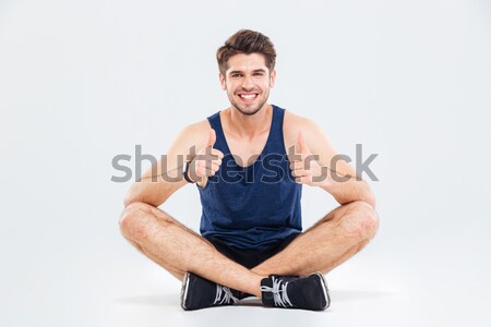 Séance jambes croisées pointant jeunes [[stock_photo]] © deandrobot