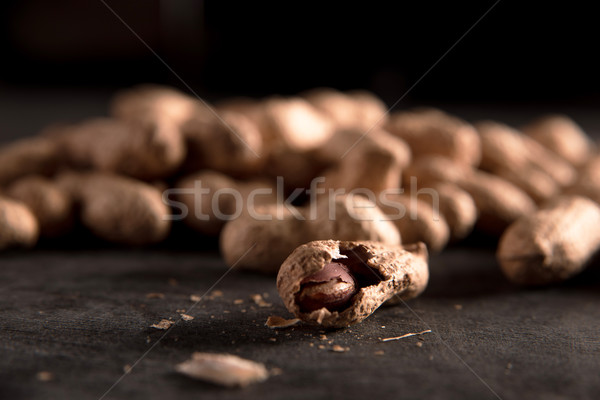 Image of dried peanut put by a row Stock photo © deandrobot
