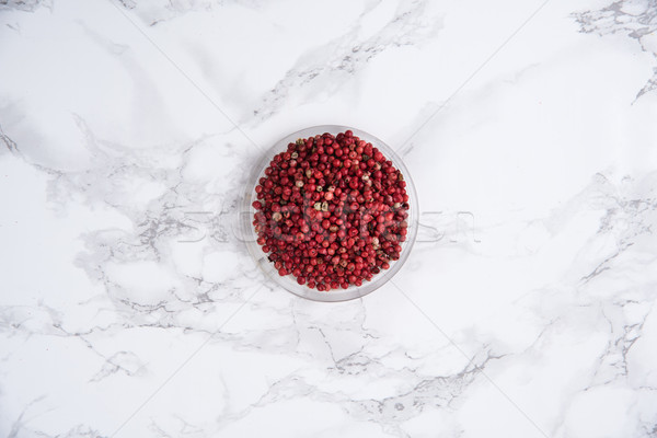 Black pepper in a bowl on white marble Stock photo © deandrobot