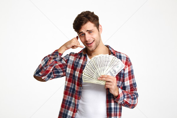 Portret glimlachend jonge man bos geld Stockfoto © deandrobot