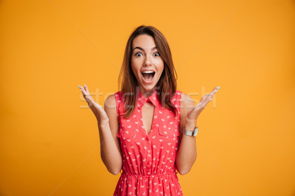 Close-up portrait of young pretty surprised woman with opened mo Stock photo © deandrobot