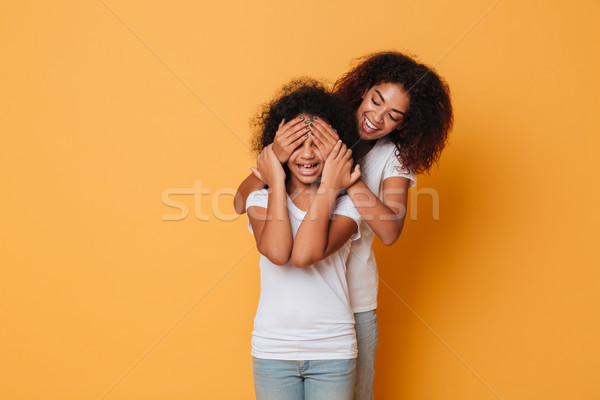 Two happy afro american sisters having fun Stock photo © deandrobot