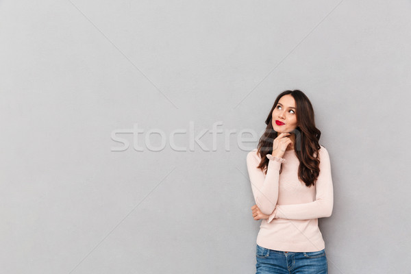 Horizontal portrait of charming brunette female with long dark h Stock photo © deandrobot