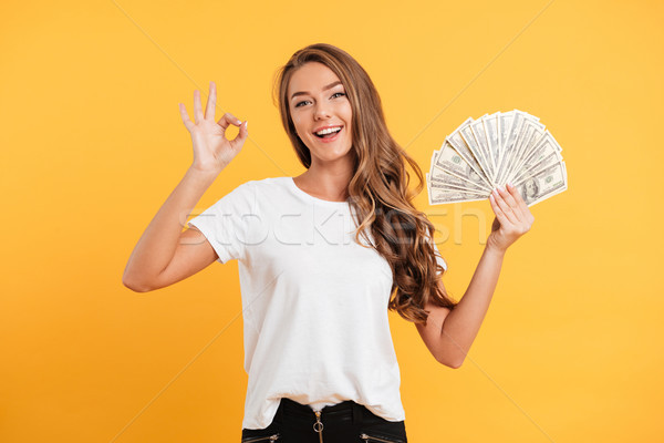 Portrait of a cheerful smiling girl Stock photo © deandrobot