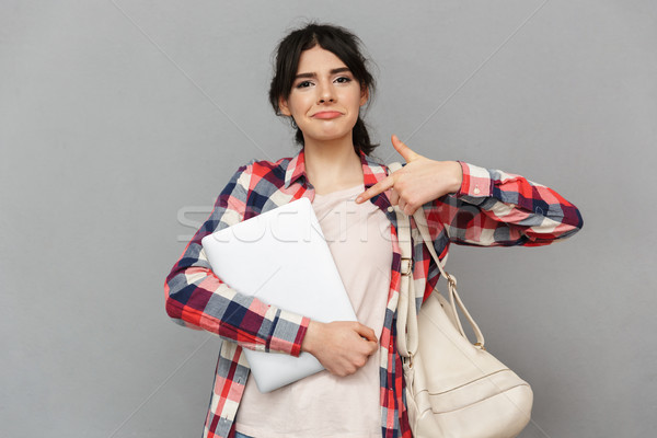 Amazing emotional young lady showing laptop computer. Stock photo © deandrobot