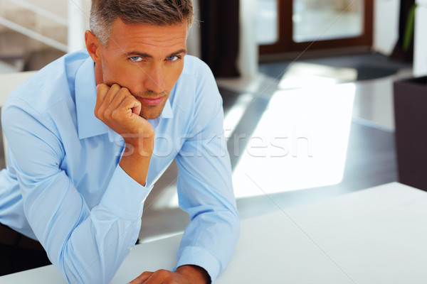 Happy handsome mature man in formal cloths at home Stock photo © deandrobot