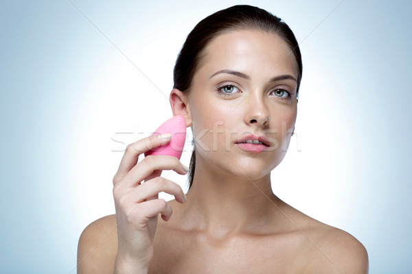 Portrait of a young beautiful woman holding soap Stock photo © deandrobot