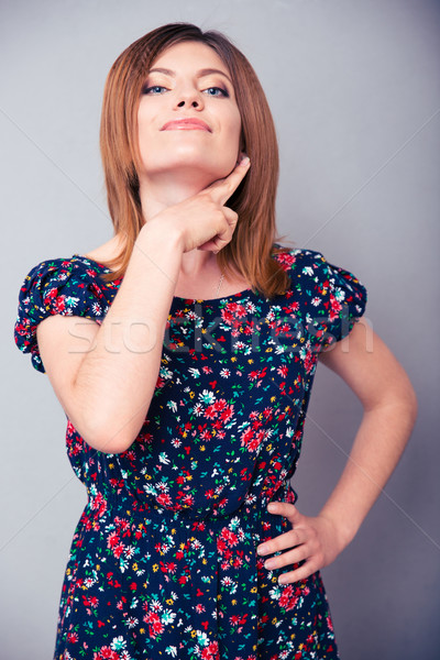 Woman showing threatening gesture Stock photo © deandrobot