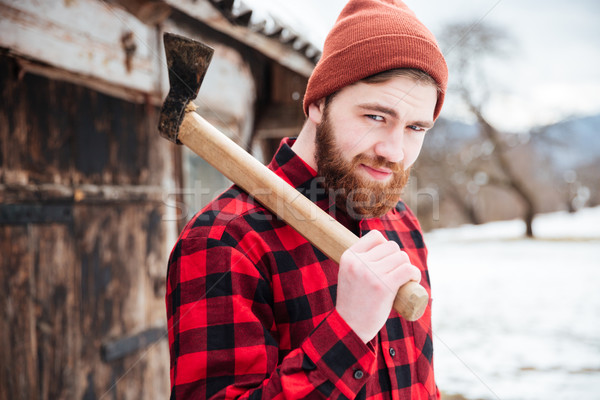 Smiling bearded man holding axe  Stock photo © deandrobot