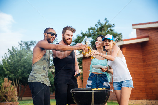 Happy teens having fun at the picnic area Stock photo © deandrobot
