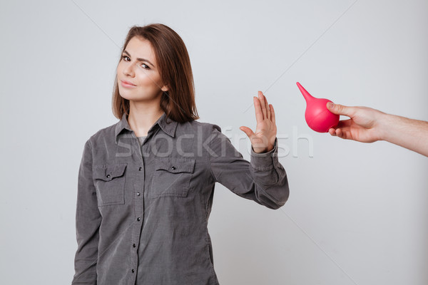 Lady make stop gesture to enema. Stock photo © deandrobot
