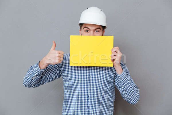 Builder holding copyspace blank make thumbs up gesture Stock photo © deandrobot