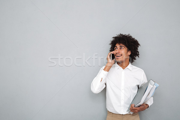 Stock photo: Portrait of an afro american man talking on mobile phone