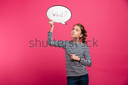 Shocked young lady standing over pink Stock photo © deandrobot