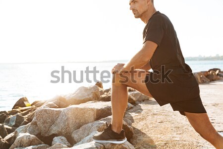 Cropped image of handsome sportsman Stock photo © deandrobot