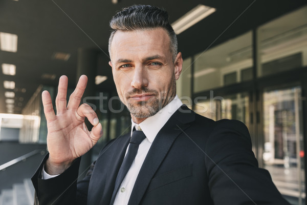 Portrait of a successful young businessman Stock photo © deandrobot