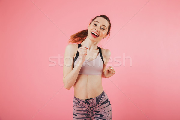 Glücklich Sportlerin läuft schauen Kamera rosa Stock foto © deandrobot