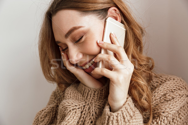 Gelukkig jonge vrouw 20s bruin haar telefoon Stockfoto © deandrobot