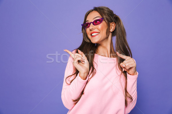 Portrait of a smiling girl in sweatshirt in sunglasses Stock photo © deandrobot
