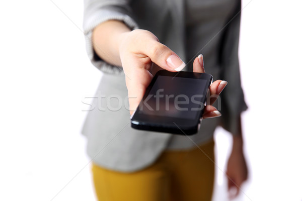 Woman passing smartphone to you isolated on white background Stock photo © deandrobot