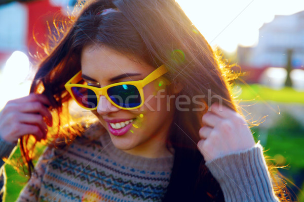 Closeup portrait of a happy fashionable woman Stock photo © deandrobot