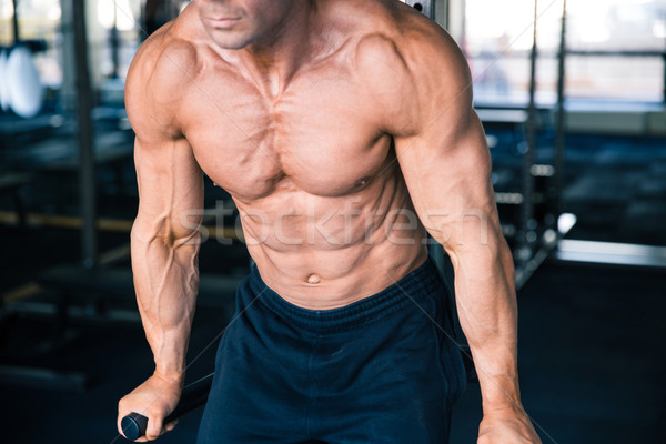 CLoseup portrait of a man workout on bars Stock photo © deandrobot