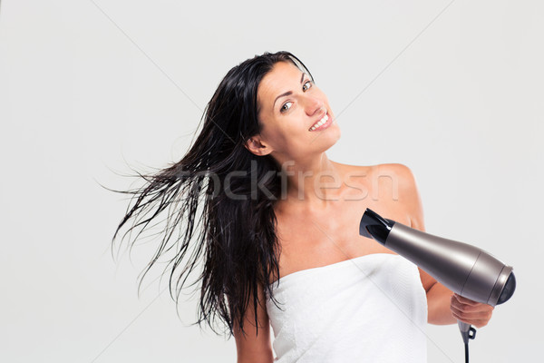 Pretty young woman in towel drying her hair Stock photo © deandrobot