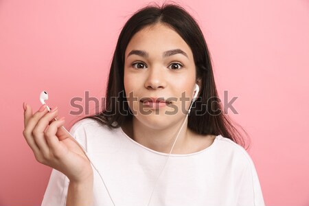 Portrait of attractive female teenager praying Stock photo © deandrobot