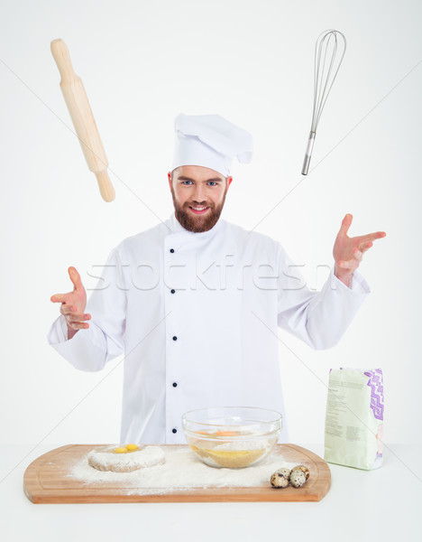 Portrait of a happy male chef cook baking  Stock photo © deandrobot