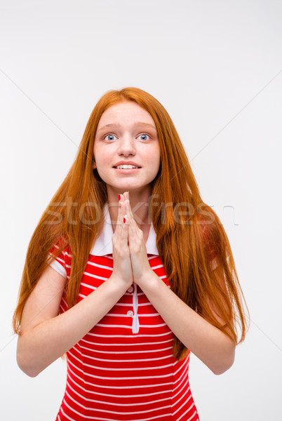 Portrait of begging excited pretty young woman Stock photo © deandrobot