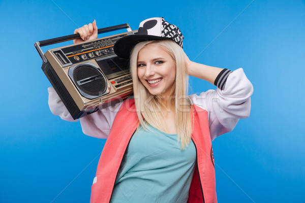 Female teenager holding boom box  Stock photo © deandrobot