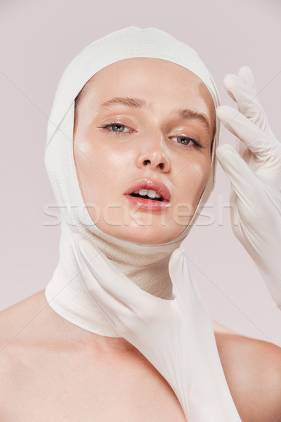 Unusual image of model with hands Stock photo © deandrobot