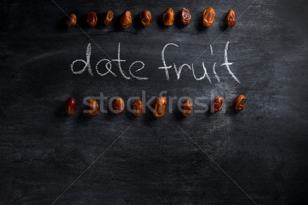 Datum Obst dunkel Tafel top Ansicht Stock foto © deandrobot