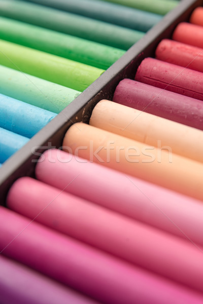 Close-up image of colorful chalk pastels in wooden box Stock photo © deandrobot