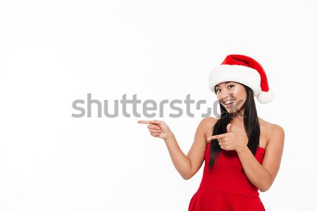 Stock photo: Portrait of a young asian woman in red christmas costume