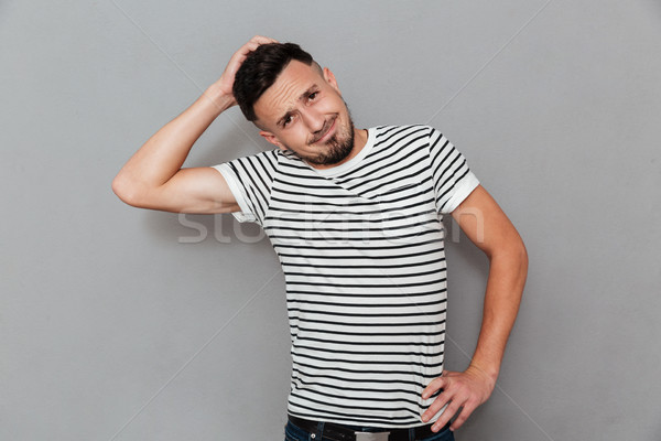Portrait of a confused thoughtful man Stock photo © deandrobot