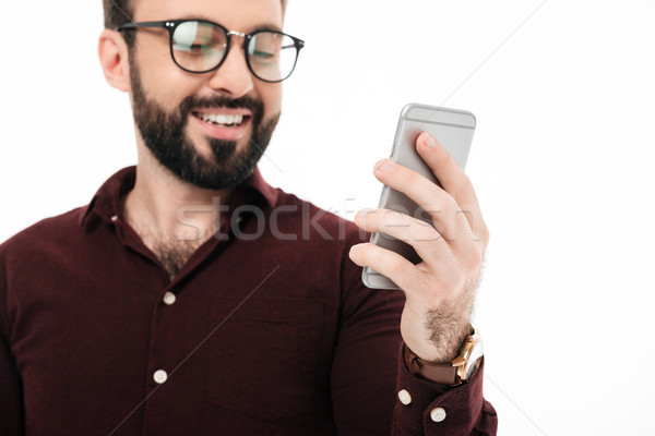 Close up portrait of a cheerful young man in eyewear Stock photo © deandrobot