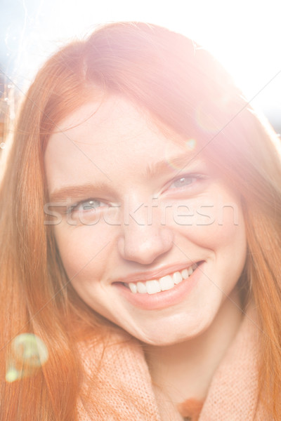 Redhead woman looking at acamera Stock photo © deandrobot