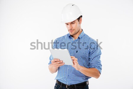 Alegre atraente construtor capacete trabalhando diagrama Foto stock © deandrobot