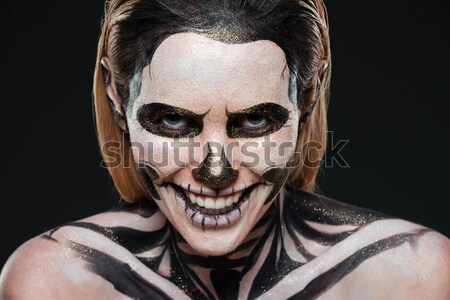 Közelkép fiatal nő vérfagyasztó csontváz smink fekete Stock fotó © deandrobot